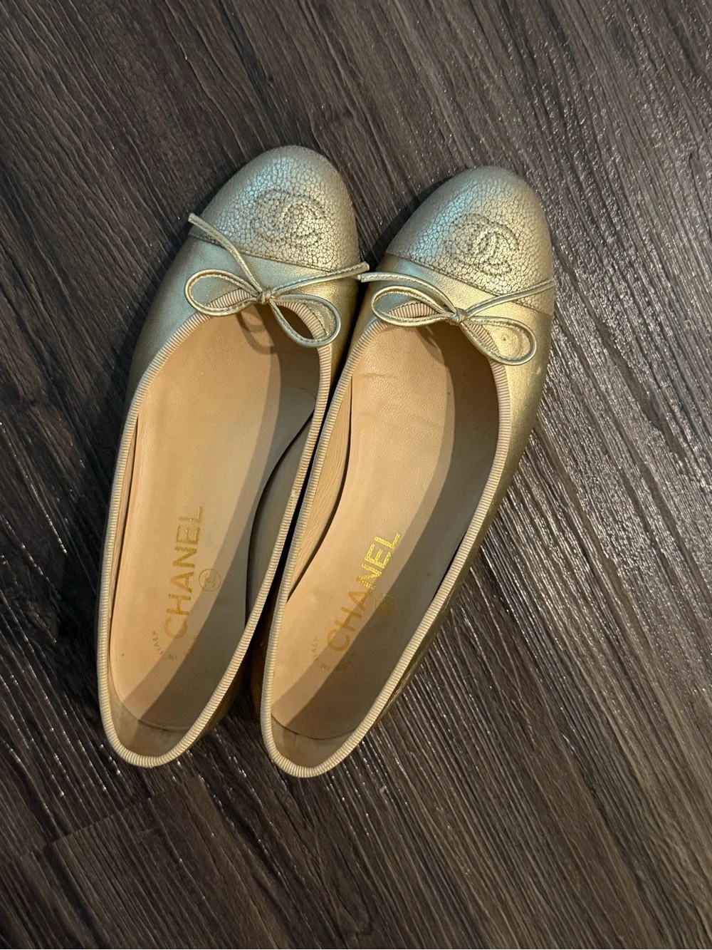 CHANEL Metallic Gold Leather Ballet Flats with Bow Accent